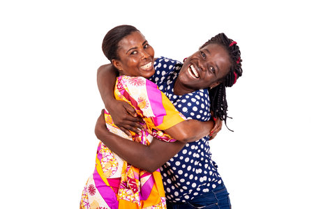 beautiful young couple hugging and smiling at the camera on white background.の写真素材