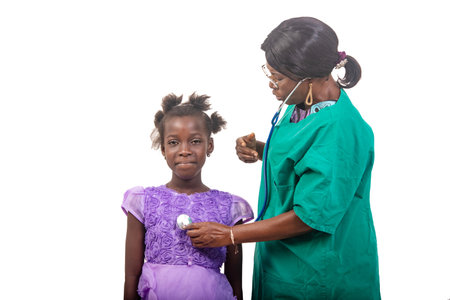 beautiful nurse in glasses standing over white background consulting female patient using stethoscope while talking.の写真素材