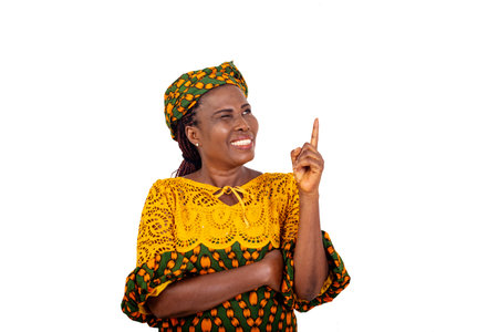 close up of beautiful woman in traditional dress standing over white background pointing finger with funny face while smiling.の写真素材