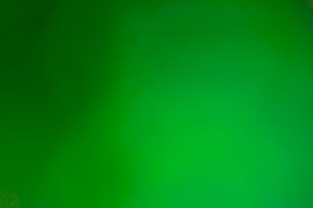 Bright green background wallpaper with black gradient.