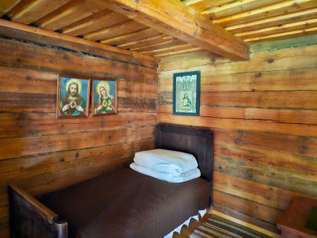 Interior room of an old house. Covered bed in the corner. Europeの写真素材
