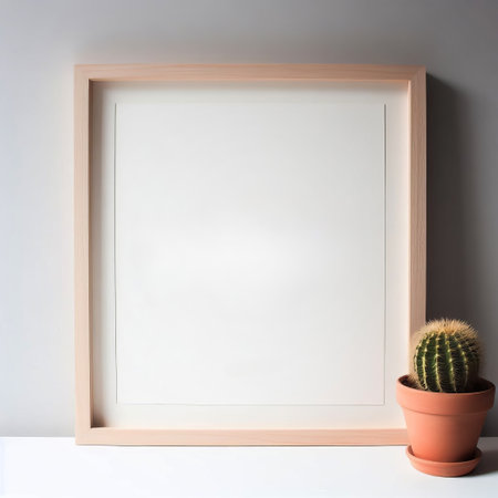 Blank picture frame with cactus on white background. Mock upの素材