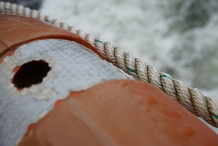 Lifesaving float installed on the boat cruising along Milford Soundsの写真素材