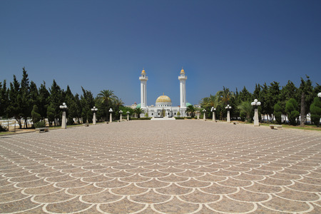 big square laid with tiles in front of palace Mausoleum of Habib Bourguiba in Tunisia.の写真素材