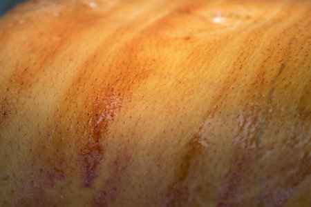 human's skin close-up anointed with iodine to asepticize before the surgery