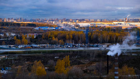 Autumn road from the height to the highway roadway. Black sky.の写真素材