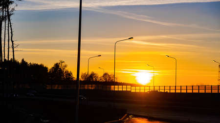 Sunset on the highway.Autumn sky at sunset Sunset is the edge of the forest. Evening sunset.の写真素材