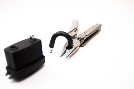 Broken lock on a white background. Lock broken cutters.の写真素材