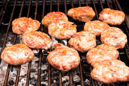 Cooking meat on the grill. Preparation vidbivnyh. Cooking hamburgers.