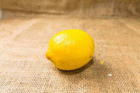 Not sliced yellow lemon for tea leaves of tea and spices.の写真素材