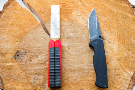 Set out a pocket knife and a pocket sharpener.の写真素材
