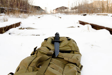 Tactical knif on sand back pack.の写真素材