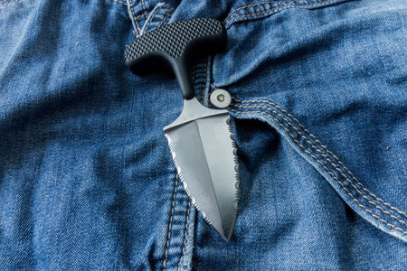 Neck knife on jeanse background.. Diagonal position.の写真素材