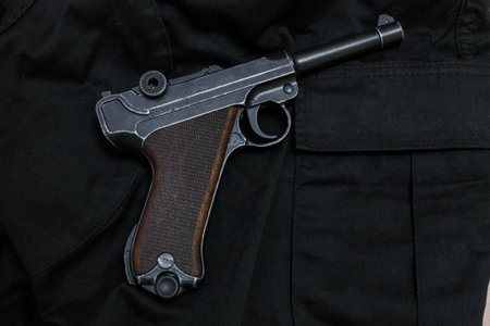 Revolver is black view left. Revolver on cloth.