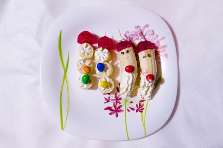 Children dessert with bananas. Art dessert for children. Peoples of bananas.の写真素材