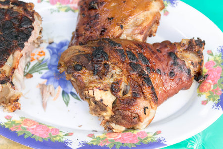 Cooked pork shank. Meat cooked on fire.