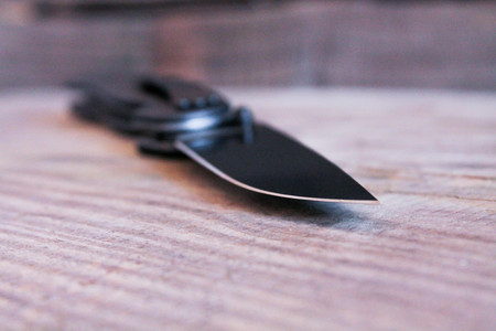 Black knife. View of the blade of the knife at an angle.の写真素材