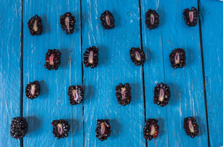 A lot of blackberries. Blackberry in a cut. Composition from the blackberry. Many repetitions....