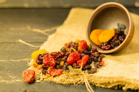 Spread dried fruits. Raspifany dry berries. Rural styleの写真素材
