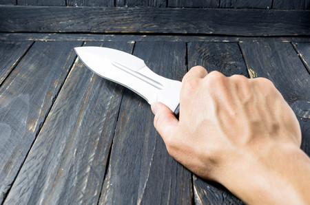 Attacking with a large knife. Military attack.の写真素材