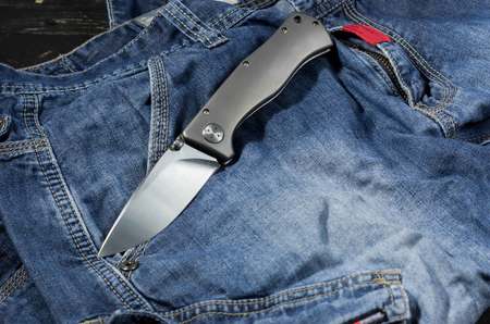 Folding knife with aluminum handle. Knife in the unfolded position. Fron side. Cold side.の写真素材