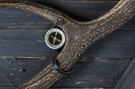 Tourist compass. Vintage compass Hiking. Black backgroundの写真素材