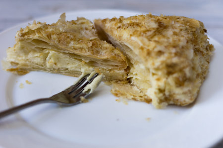 Pieces of sliced cake on a white plate.