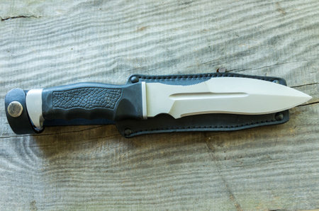 Tactical knife and leather sheath. Combat knife.の写真素材