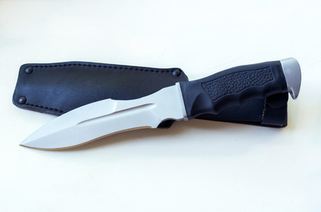 A large knife with a sword's elegant form and a leather case.. Isolate.の写真素材