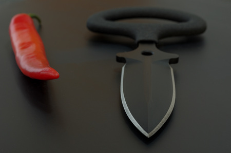 Black and red. Black background and red chili pepper.の写真素材
