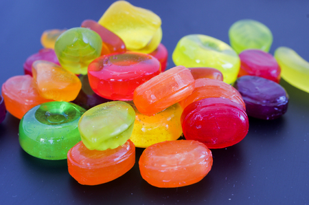 Many multi-colored sweets. Colored sweets on a dark background. Sweets.の写真素材