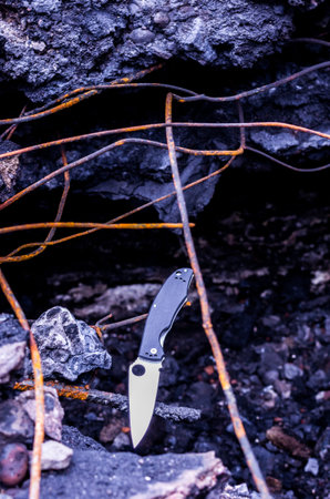 The knife at the bottom of the vertical frame. Place for text. Urban style.の写真素材