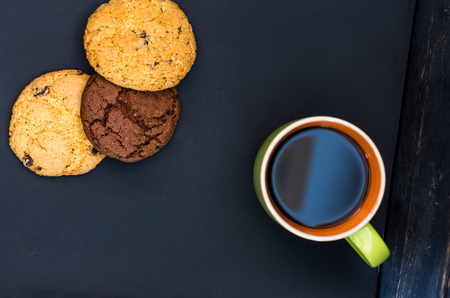 Breakfast with coffee and gingerbread. Top view. Lie flat on a black background.の写真素材