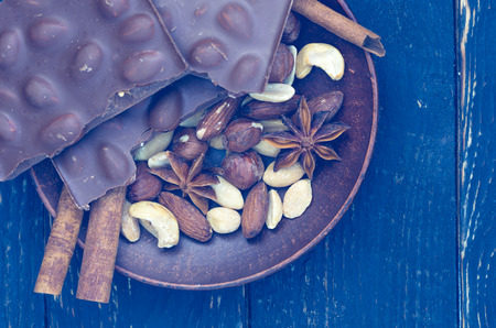 Coffee composition with chocolate and spices. View from above. Blue toning. Flat lie. Low key.の写真素材
