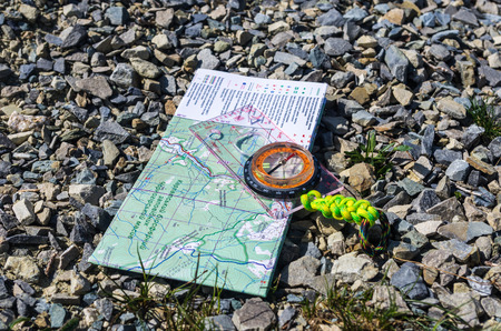 Tourist guide and hand-held compass.の写真素材