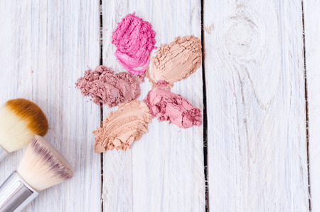 Sprayed multi-colored cosmetics. Makeup brushes. Colorful cosmeticsの写真素材