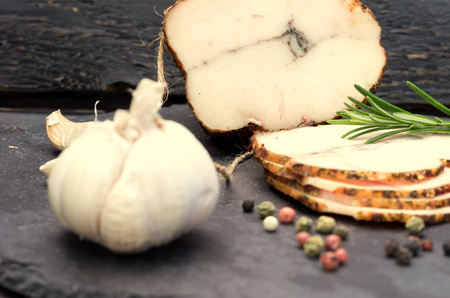 Head of rural garlic. Sliced meat. Front viewの写真素材