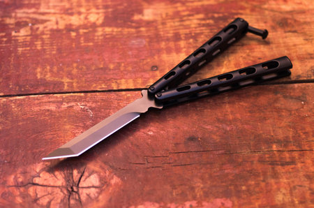 Butterfly knife. Knife balisong. The knife is black
