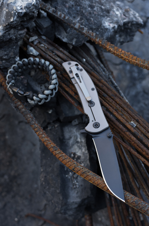 Knife view from above. Bracelet of Survival. Vertical shot.の写真素材