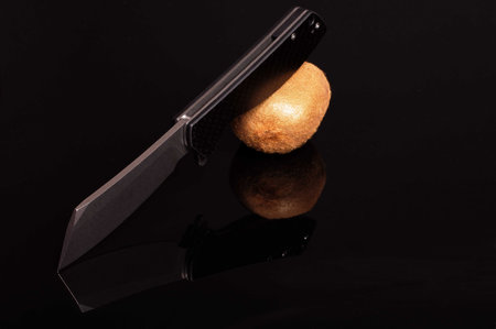 The knife is in a tilted position. Knife at an angle.