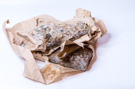 Spoiled product and packaging. Rotten packaging and goods. Front.の写真素材