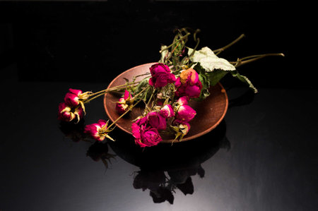 Dried dwarf roses. Cut bouquet of roses. Dead flowers.