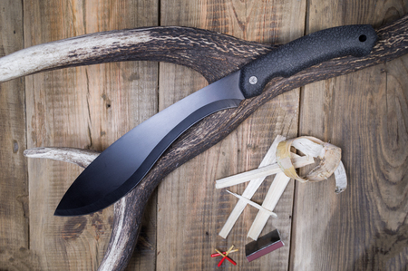 Hunting knife on a deer horn. Hunting matches. Top.の写真素材