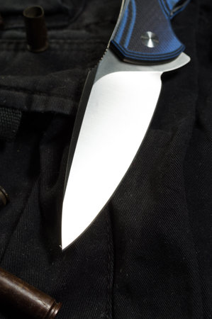 Blade knife close up. The edge of the knife close-up. Blade knife tilted. Vertical frame.