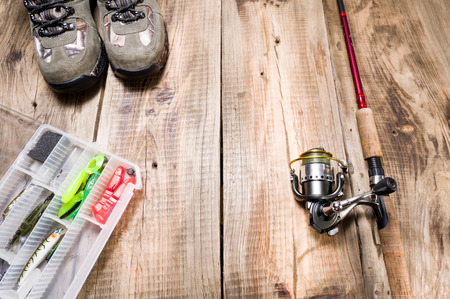 Fishing gear. Fishing box and bait. Top view on composition.の写真素材