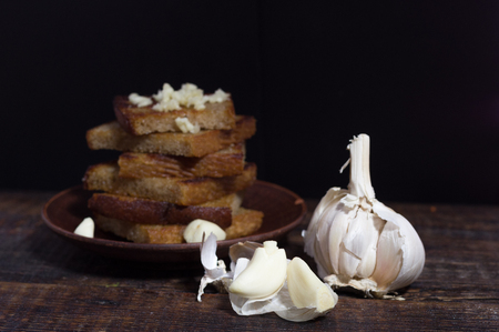 Garlic toasted bread Bread and garlic. Peeled and grated garlic.の写真素材
