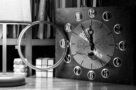Leaving time. Old hand clock. Wooden clockwork. Black and white photography.