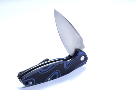 The position of the knife in an unusual position. The knife is in a curved position. Isolate.