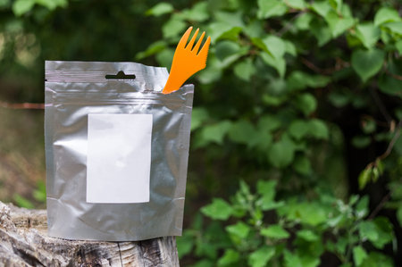 Food in a foil bag. Fast food in the package. A bag of food.