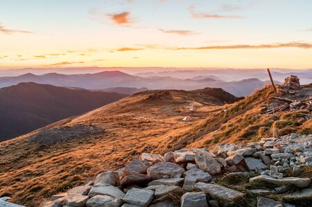 View of the mountains from a height. Mountain landscape. Tourist tent. Sunrise.の写真素材